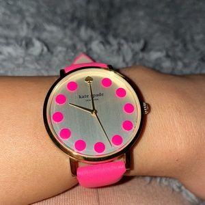 Kate Spade Pink Watch with a gold bezel and metallic face